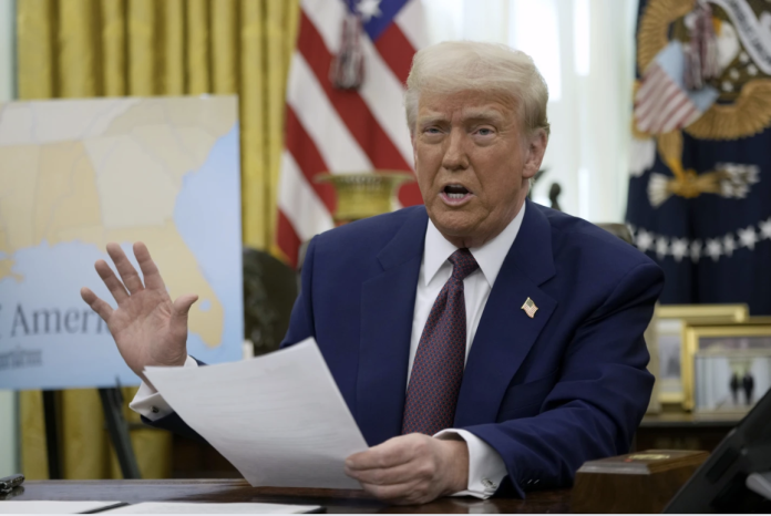 President Donald Trump speaks to reporters in the Oval Office of the White House, Feb. 13, 2025, in Washington. (AP Photo/Ben Curtis)